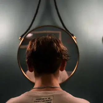 man looking in mirror